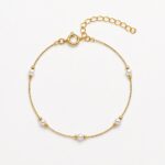 Pulseira fio brilhante com pérolas banhado a ouro 18k